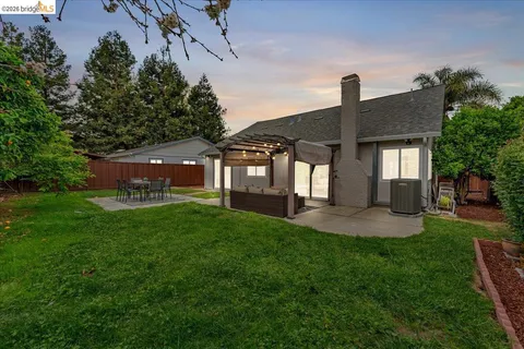 a front view of a house with a garden and porch
