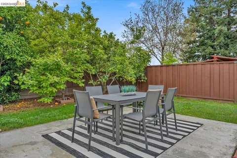 a view of a table and chairs in the patio
