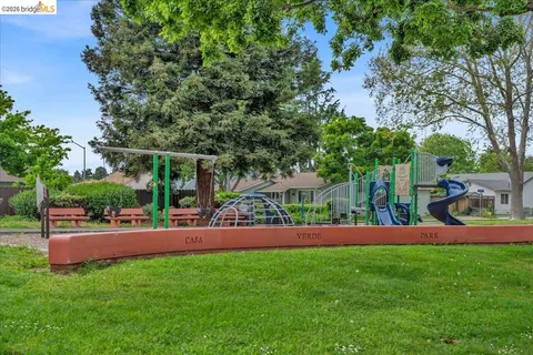 a view of a yard with a patio