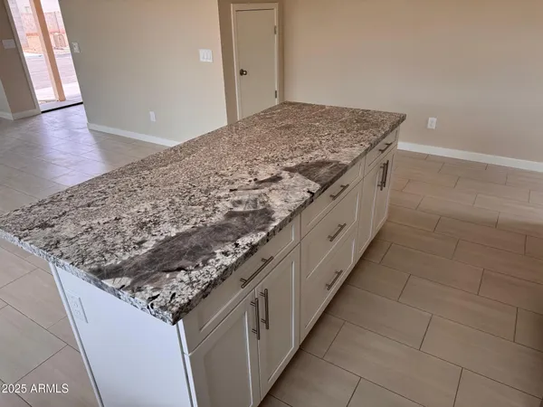 a kitchen with appliances cabinets and a counter top space