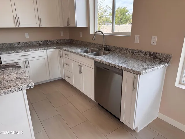 a view of an empty room and closet area