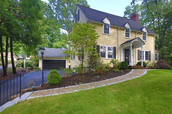 76 Alban Road Newton, MA 02468 - Photo 1 of 19 a front view of a house with a yard and garage