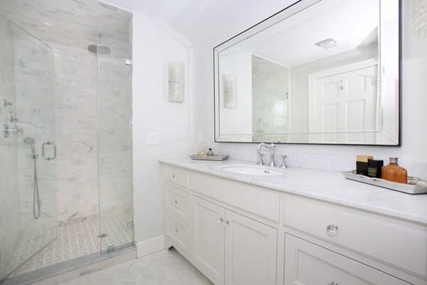 76 Alban Road Newton, MA 02468 - Photo 13 of 19 a bathroom with double sink and a mirror
