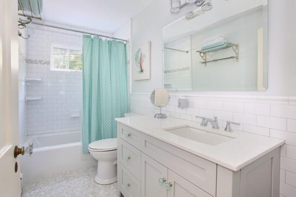76 Alban Road Newton, MA 02468 - Photo 15 of 19 a bathroom with a sink toilet tub and shower