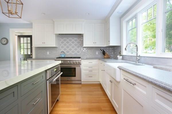 76 Alban Road Newton, MA 02468 - Photo 2 of 19 a kitchen with white cabinets appliances a sink and a window