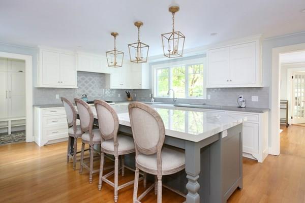 76 Alban Road Newton, MA 02468 - Photo 3 of 19 a kitchen with granite countertop white cabinets and window