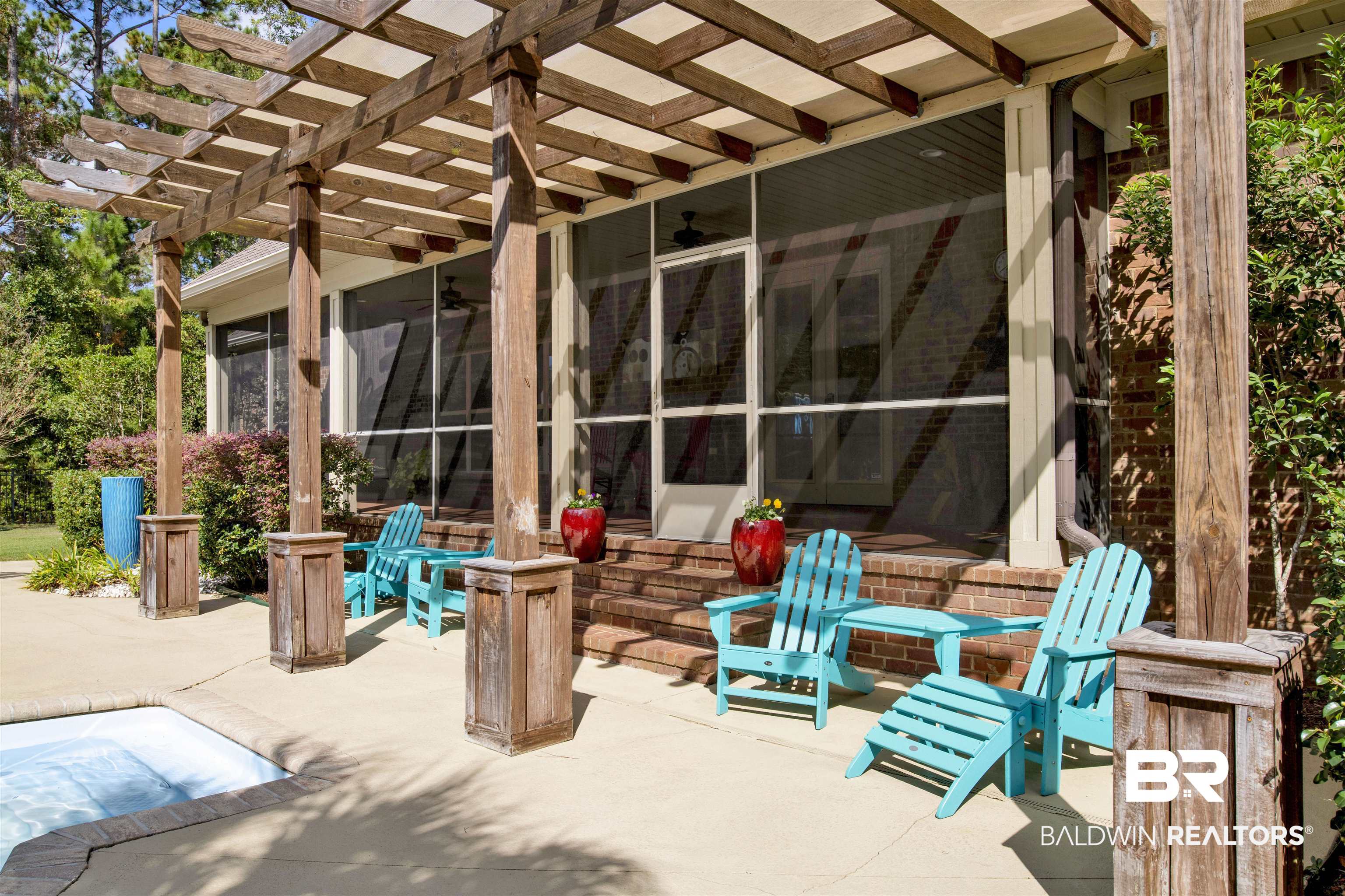 18360 Treasure Oaks Road Gulf Shores, AL 36542 - Photo 26 of 57 View of patio / terrace featuring ceiling fan, a sunroom, and a pergola