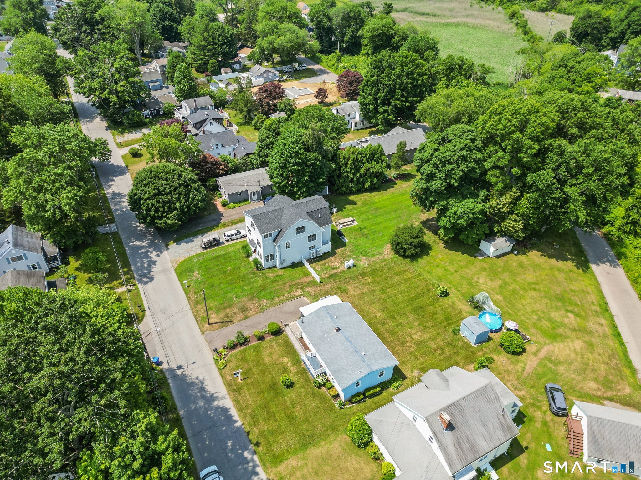 53 Chalker Beach Road Old Saybrook, CT 06475 - Photo 2 of 24 View of yard. Prperty line ends at the shed.