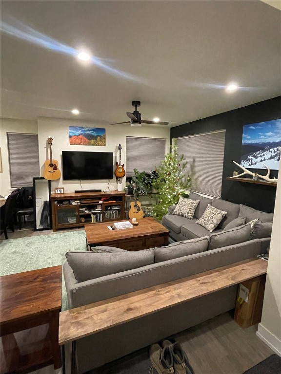 84 Haymaker Street, Unit 84 Silverthorne, CO 80498 - Photo 3 of 11 a living room with furniture and a flat screen tv