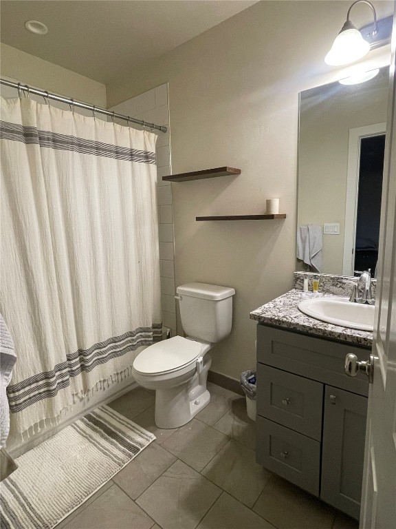 84 Haymaker Street, Unit 84 Silverthorne, CO 80498 - Photo 6 of 11 a bathroom with a granite countertop toilet sink and mirror