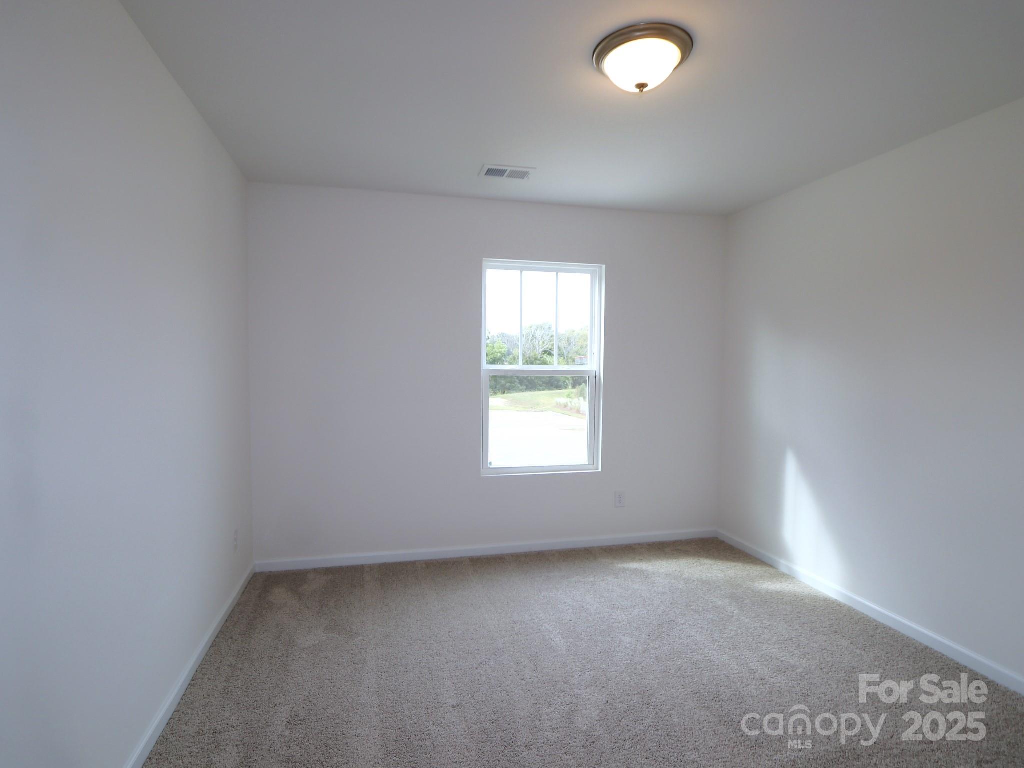 1008 Overbrook Place Wingate, NC 28174 - Photo 12 of 18 an empty room with a window