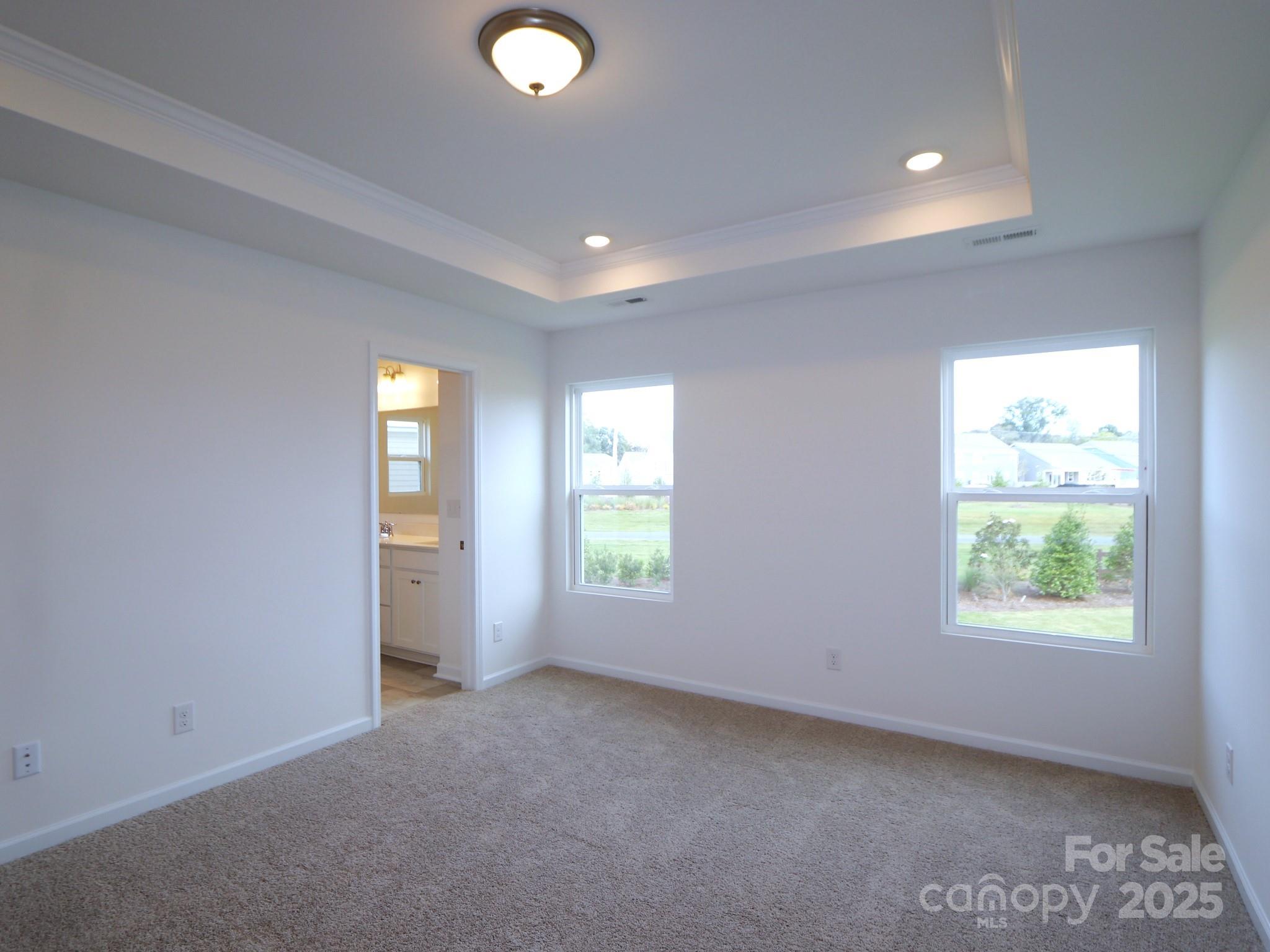 1008 Overbrook Place Wingate, NC 28174 - Photo 15 of 18 an empty room with windows