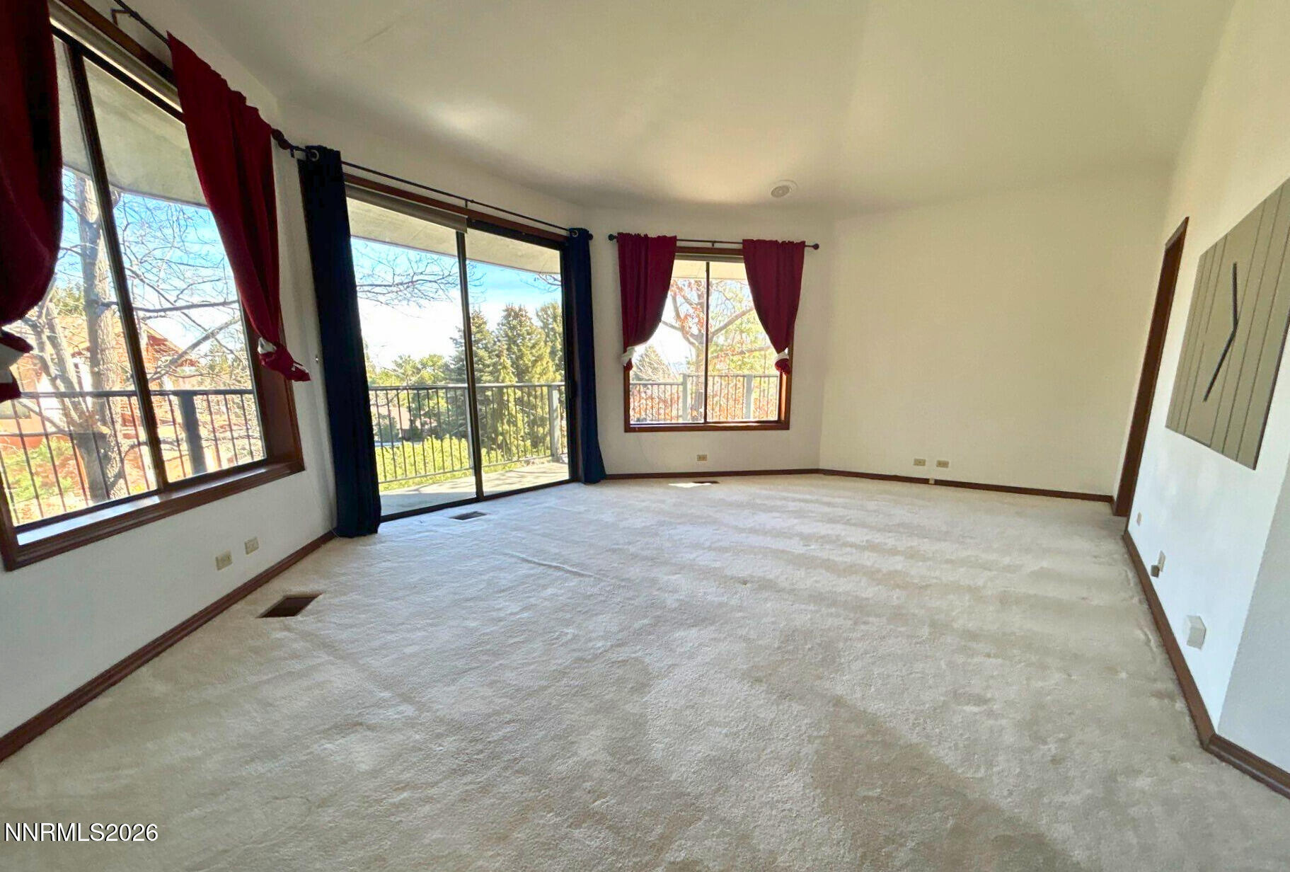 2795 West Lake Ridge Reno, NV 89519 - Photo 13 of 31 a view of an empty room with a fireplace and a large window