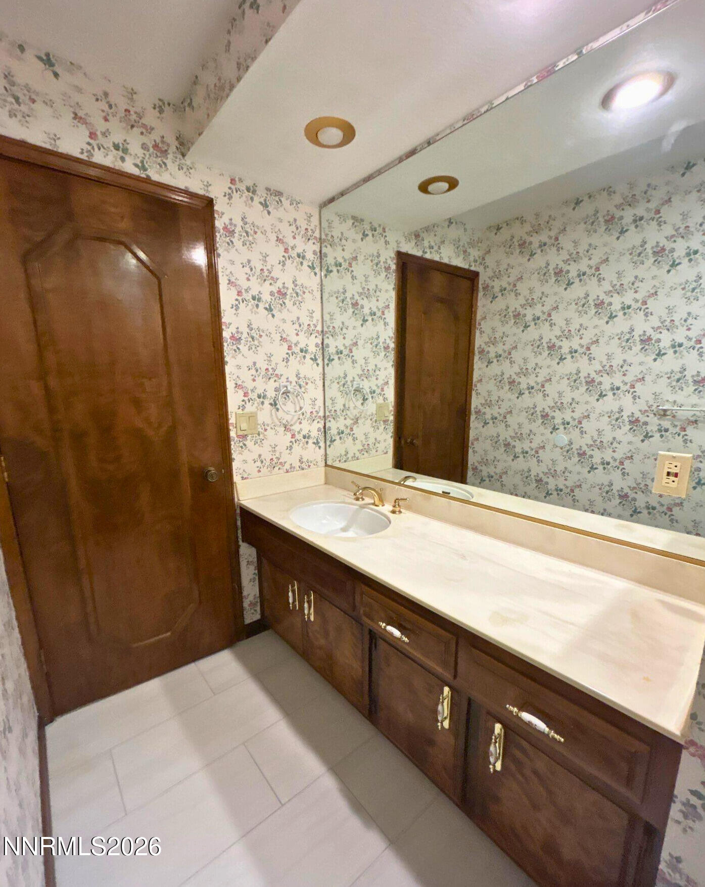 2795 West Lake Ridge Reno, NV 89519 - Photo 18 of 31 a bathroom with a double vanity sink and mirror