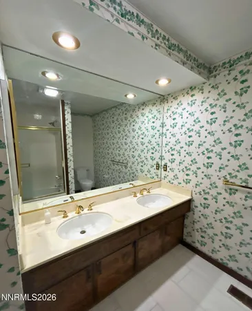 a view of empty room with a fireplace and windows