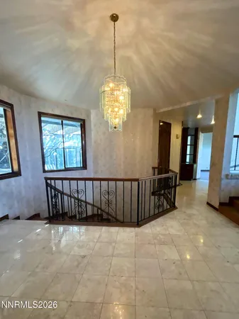 a view of a chandelier and window in a room