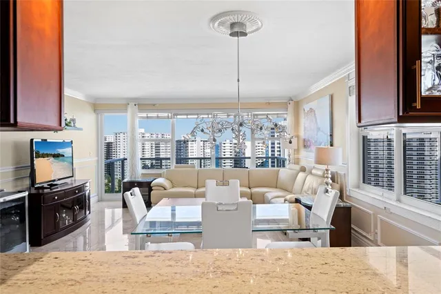 a kitchen with stainless steel appliances granite countertop a sink and a counter top space