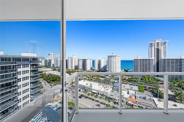 a view of a garden with chairs and a yard