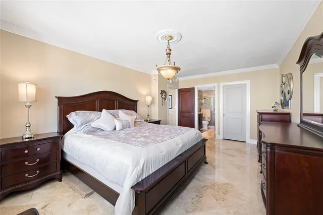 a bedroom with a bed and a cabinets