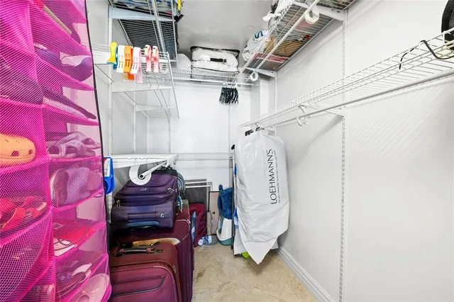 a bathroom with a granite countertop toilet a sink and a bathtub