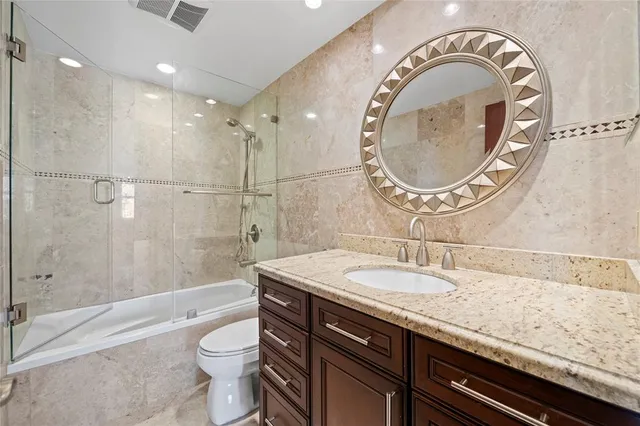 a view of a dining room with furniture water view and mountain view