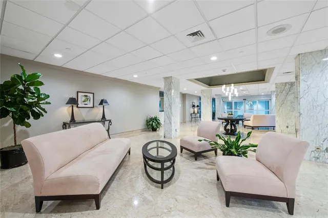 a reading room with furniture book shelf and a book shelf