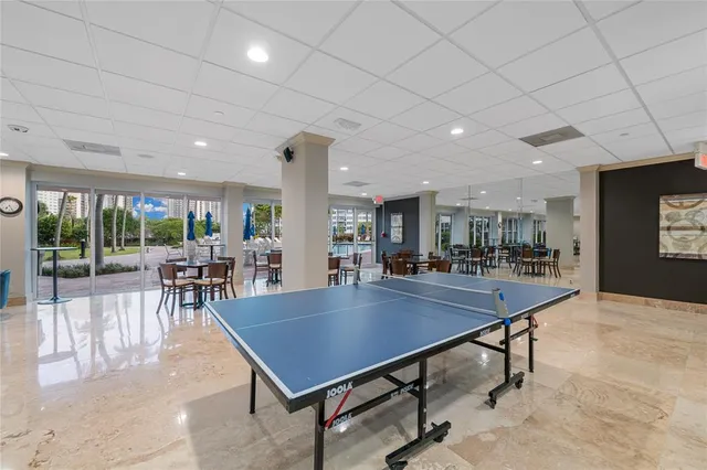 an aerial view of residential houses with outdoor space and lake view