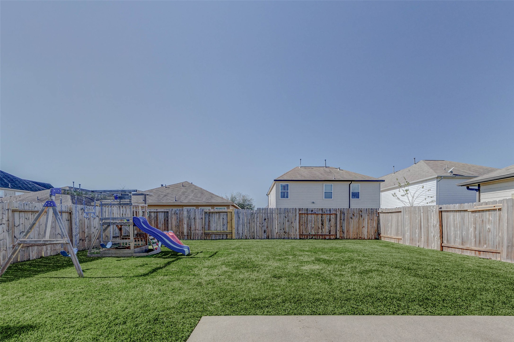 3027 Upland Spring Trace Katy, TX 77493 - Photo 25 of 29 a view of backyard with small garden and wooden fence
