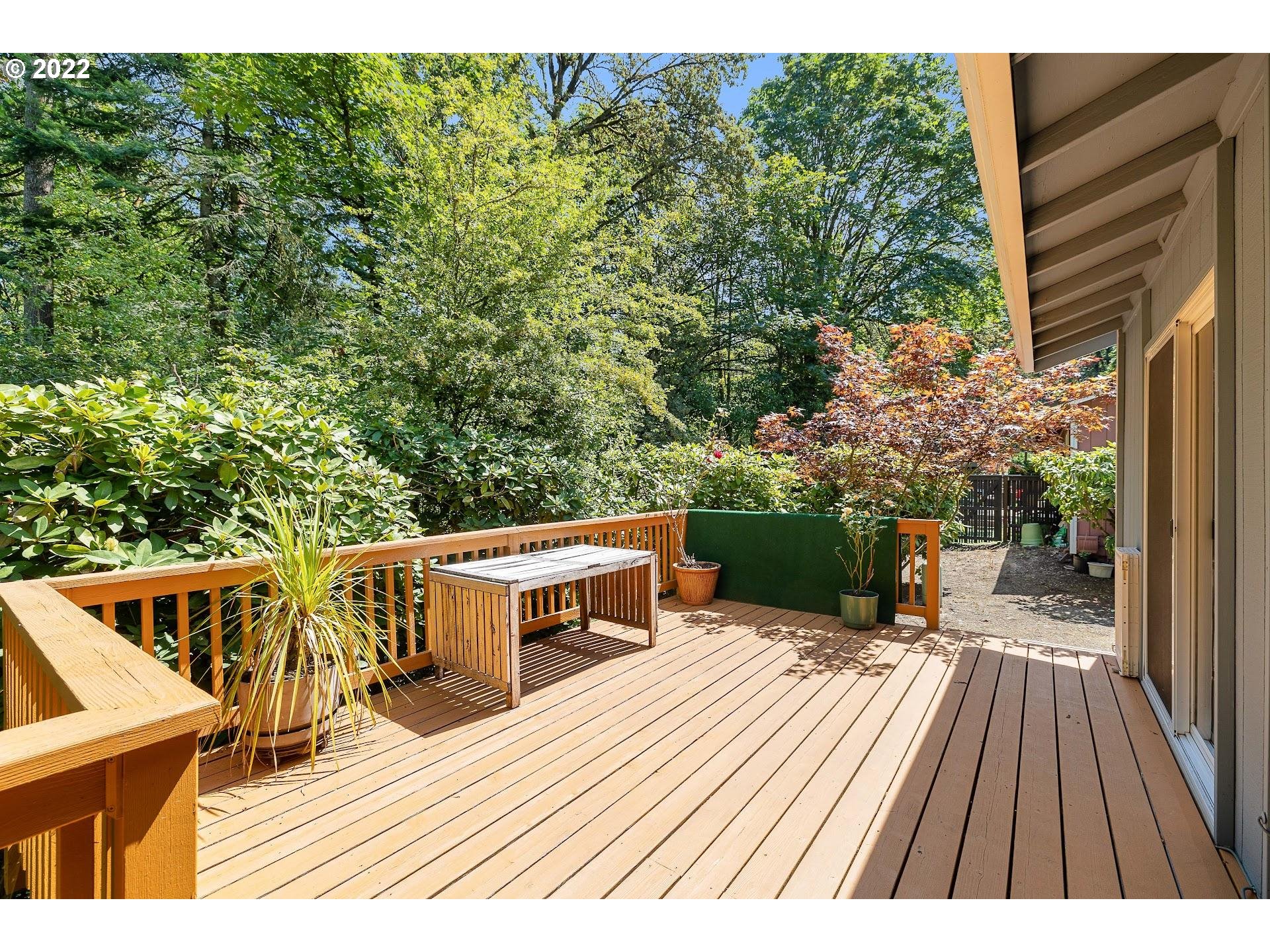 4416 Northwest Barnes Road Portland, OR 97210 - Photo 18 of 23 a view of a balcony with chairs and wooden floor
