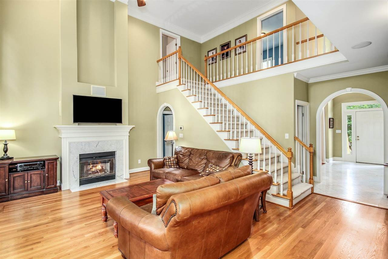 4812 Salem Ridge Road Holly Springs, NC 27540 - Photo 12 of 30 Gorgeous fireplace, tons of windows and built-ins! Soaring 2 story Family Room
