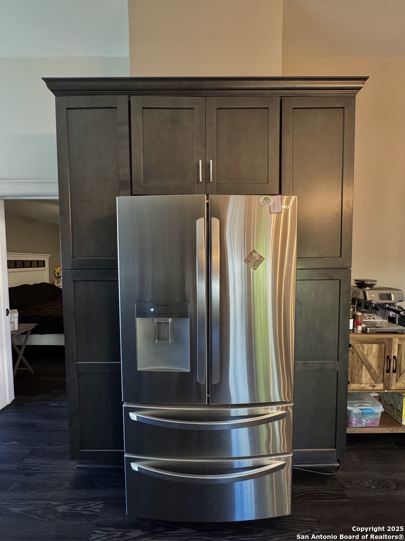 1106 North High Street Uvalde, TX 78801 - Photo 15 of 26 a metallic refrigerator freezer sitting in a kitchen