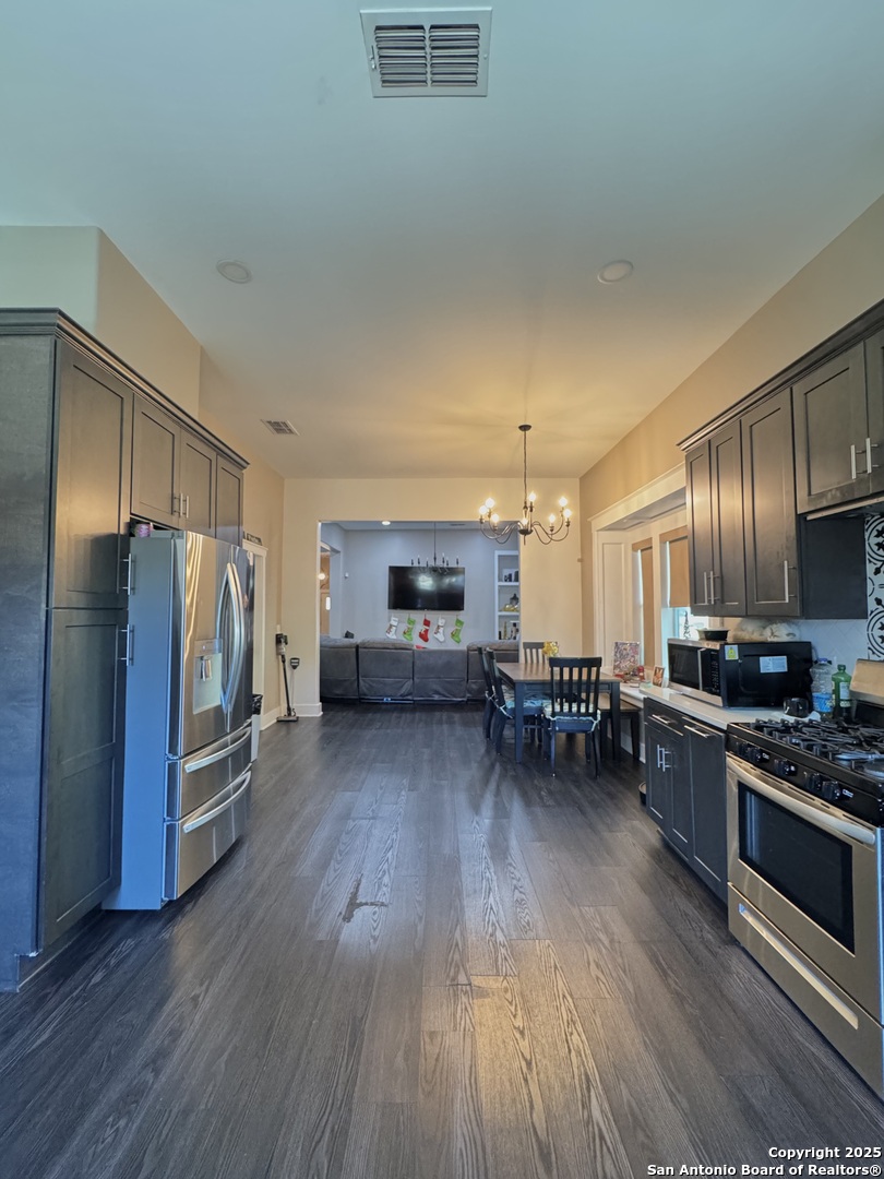 1106 North High Street Uvalde, TX 78801 - Photo 16 of 26 a kitchen with sink and refrigerator