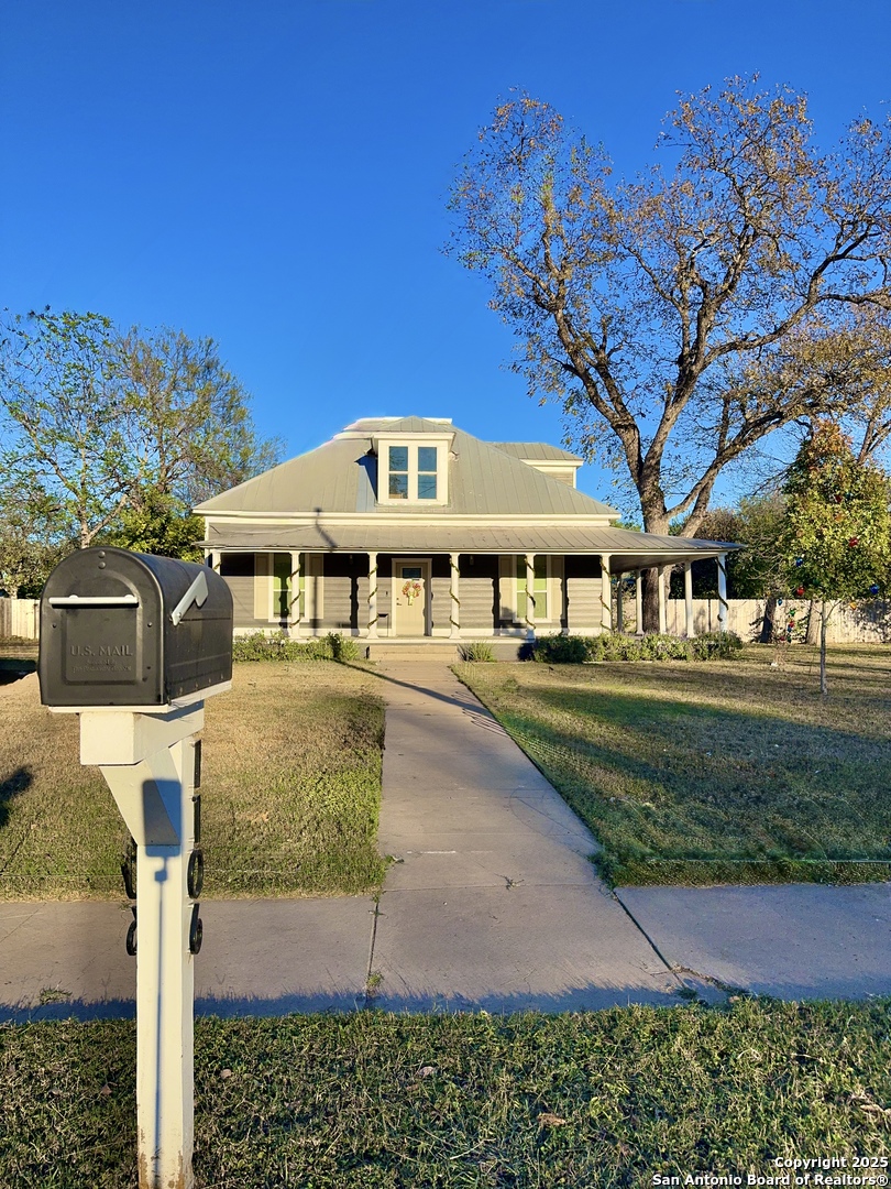 1106 North High Street Uvalde, TX 78801 - Photo 2 of 26 a front view of a house with a yard