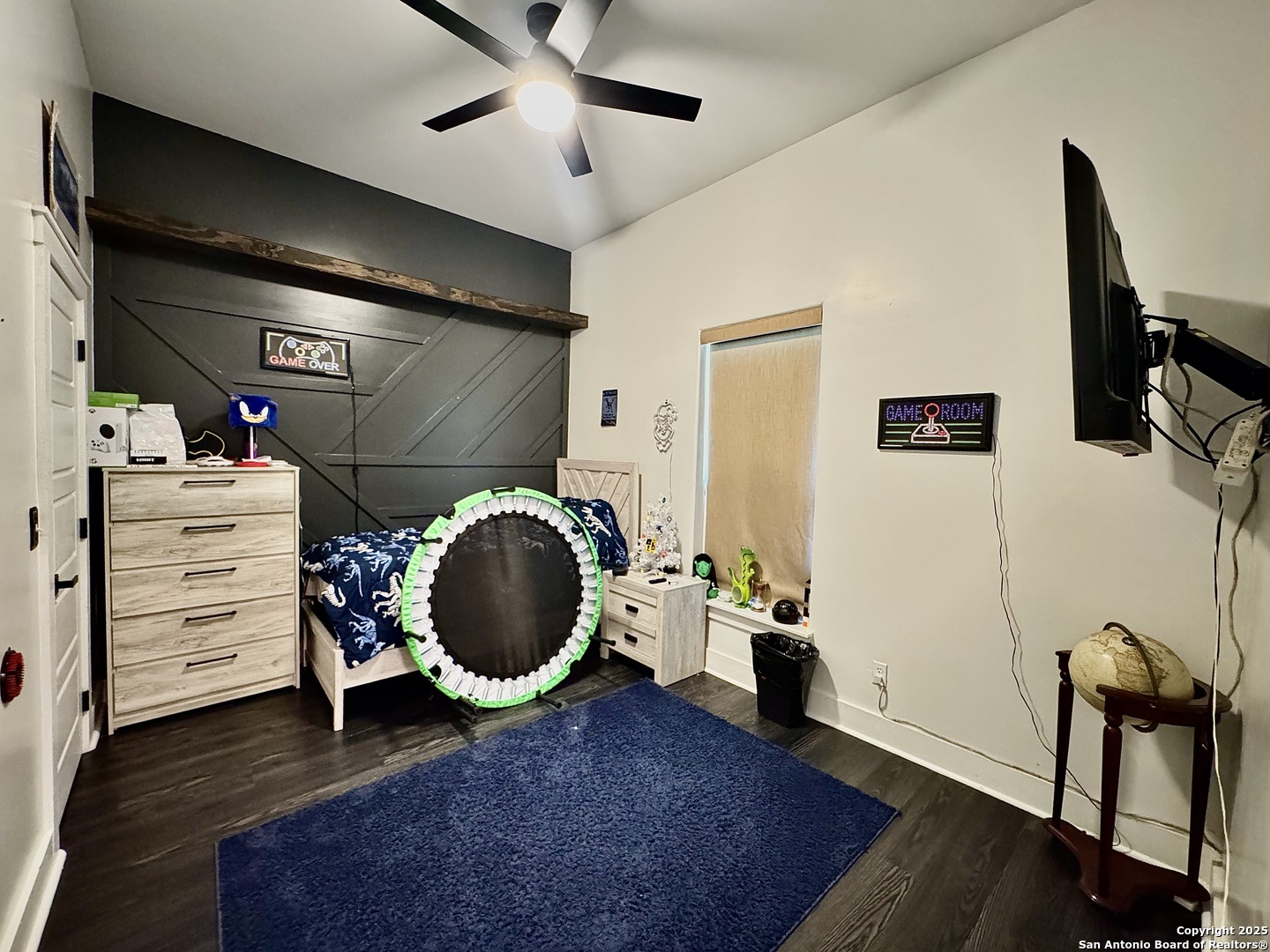 1106 North High Street Uvalde, TX 78801 - Photo 5 of 26 a view of a livingroom with furniture and a fan