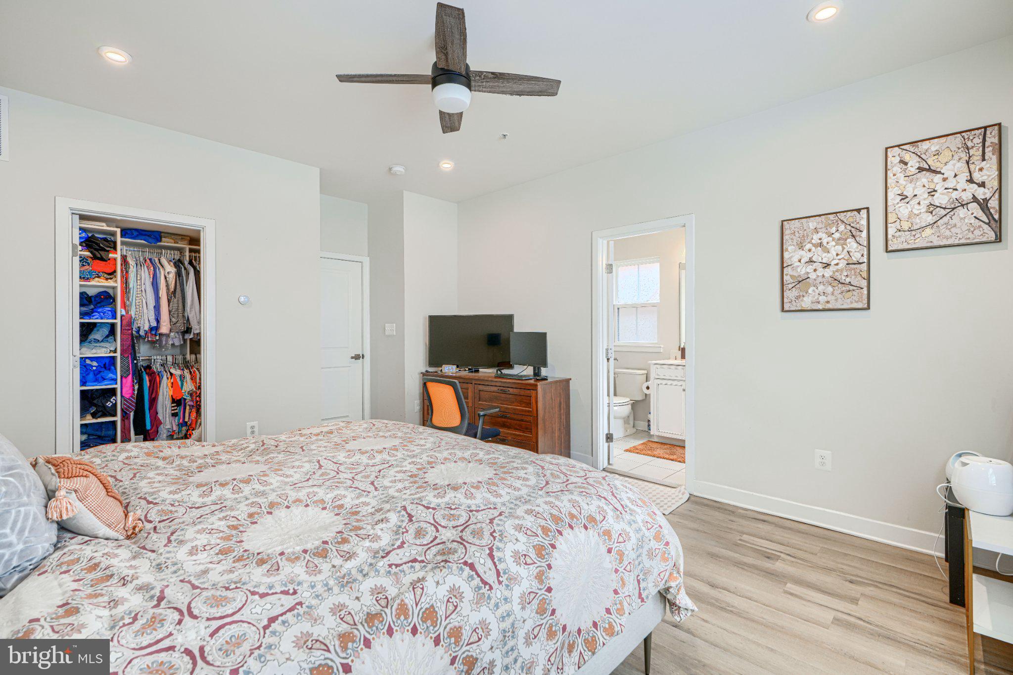 1510 Decatur Street Baltimore, MD 21230 - Photo 16 of 27 a bedroom with a large bed and a tv