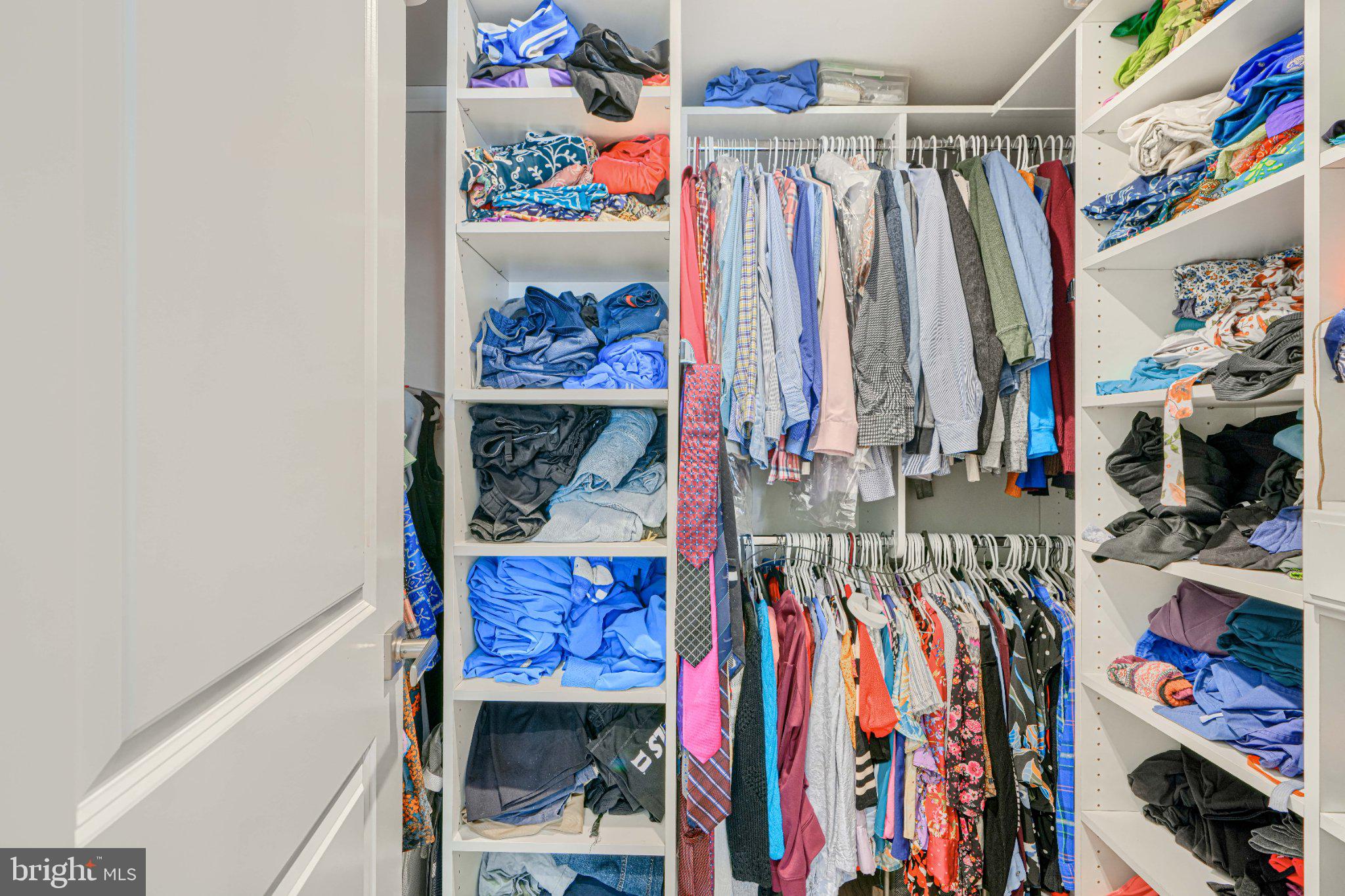 1510 Decatur Street Baltimore, MD 21230 - Photo 17 of 27 a view of walk in closet with clothes and shoes