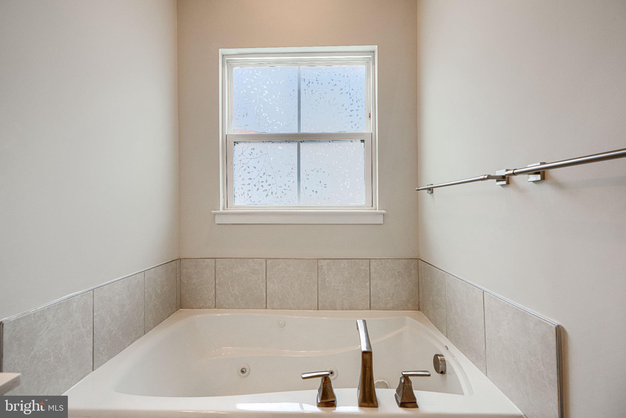 1510 Decatur Street Baltimore, MD 21230 - Photo 20 of 27 a bath tub sitting next to a window