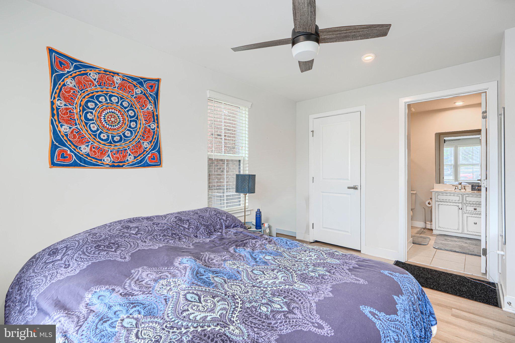 1510 Decatur Street Baltimore, MD 21230 - Photo 3 of 27 a bedroom with a large bed and a dresser