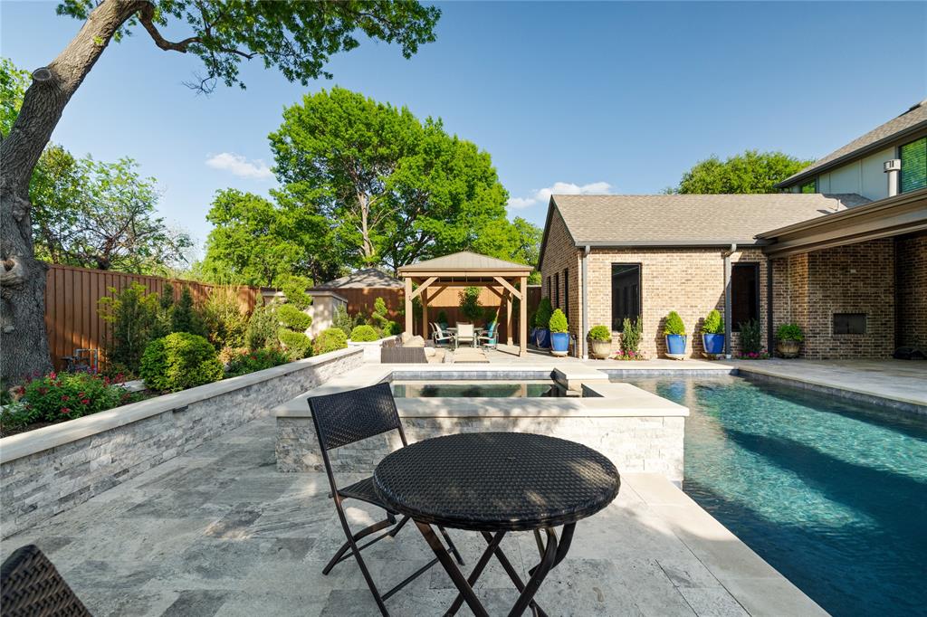 5019 Lark Lane Dallas, TX 75209 - Photo 27 of 32 a view of a patio with table and chairs potted plants and large tree