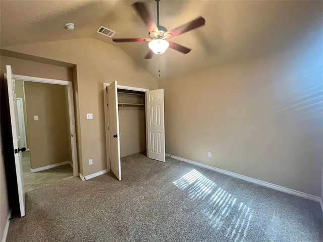 a view of an empty room and a window