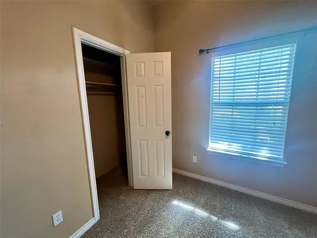 a kitchen with stainless steel appliances granite countertop a sink and a stove