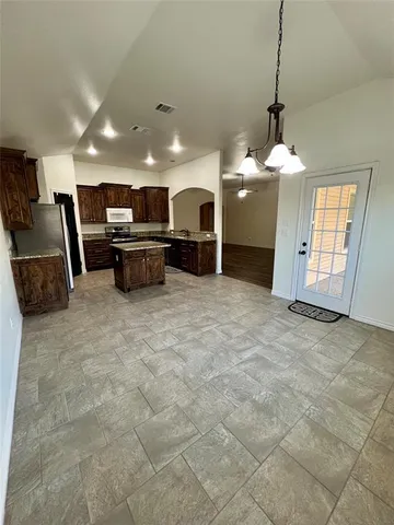 a view of an empty room with a large window