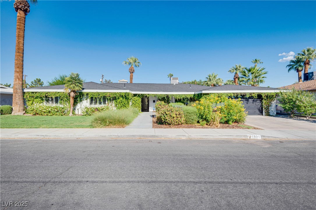 1321 South 7th Street Las Vegas, NV 89104 - Photo 1 of 47 View of front of home with concrete driveway and a