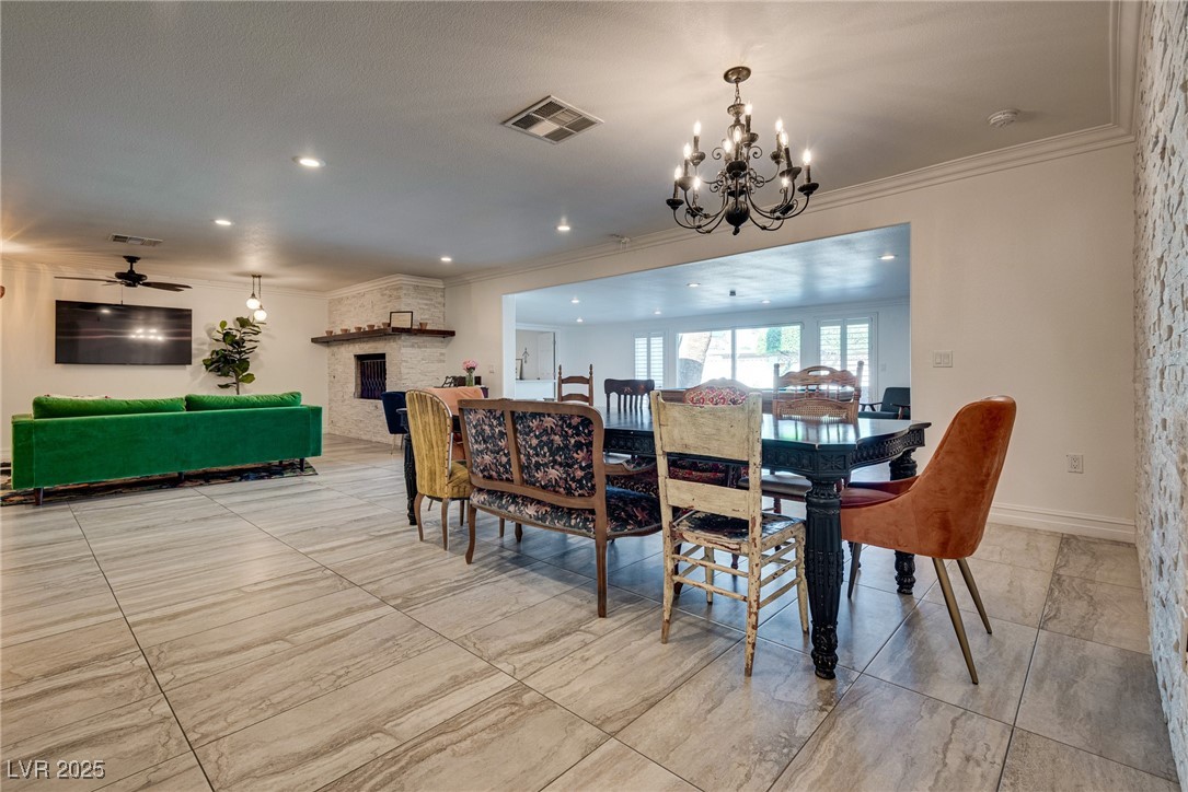 1321 South 7th Street Las Vegas, NV 89104 - Photo 12 of 47 Dining room with a chandelier, crown molding, a fi