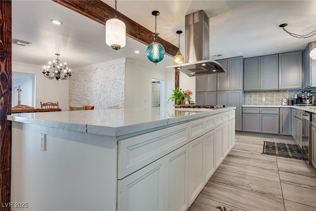 1321 South 7th Street Las Vegas, NV 89104 - Photo 13 of 47 Kitchen featuring island range hood, gray cabinets