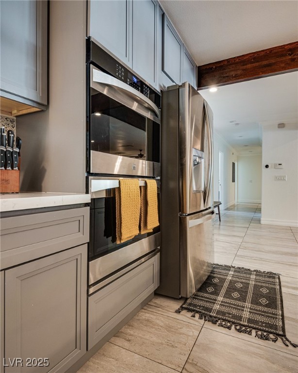 1321 South 7th Street Las Vegas, NV 89104 - Photo 18 of 47 Kitchen featuring stainless steel appliances, beam
