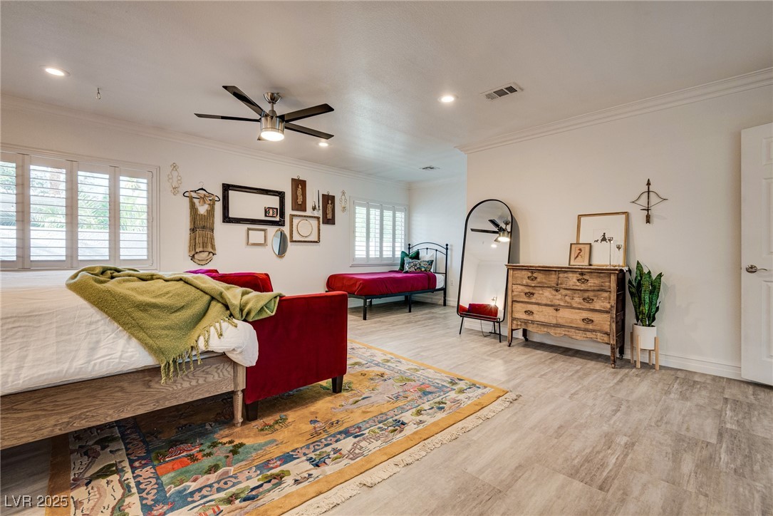1321 South 7th Street Las Vegas, NV 89104 - Photo 24 of 47 Bedroom featuring crown molding, wood finished flo