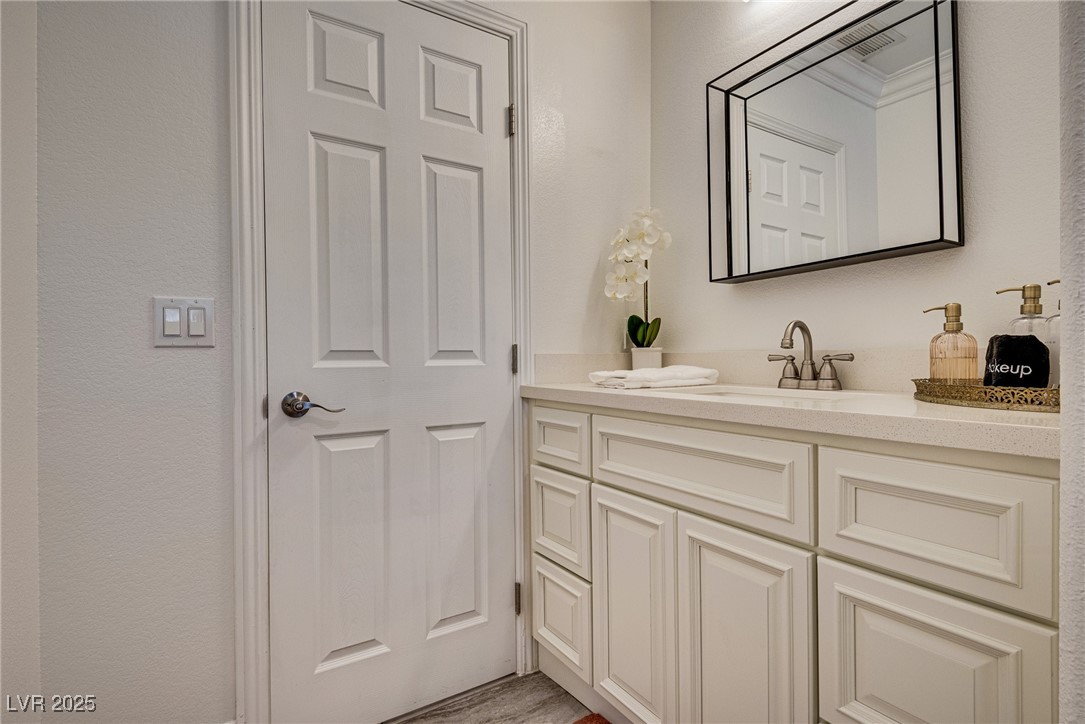 1321 South 7th Street Las Vegas, NV 89104 - Photo 28 of 47 Bathroom featuring vanity and a textured wall