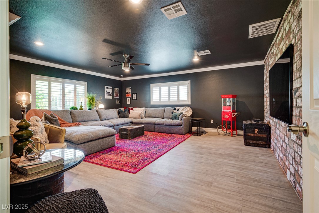 1321 South 7th Street Las Vegas, NV 89104 - Photo 42 of 47 Living room with ornamental molding, a ceiling fan