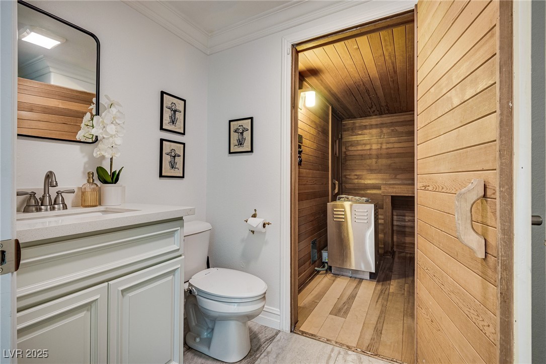 1321 South 7th Street Las Vegas, NV 89104 - Photo 45 of 47 Bathroom with vanity, wood walls, wood finished fl